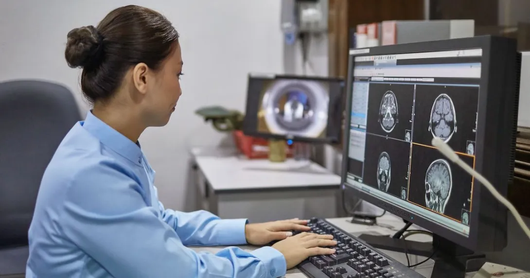 A radiologist looking at brain scans
