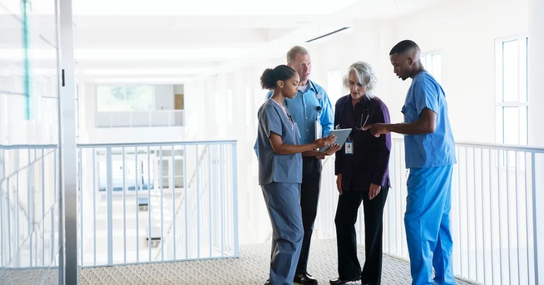 Healthcare providers standing in a circle