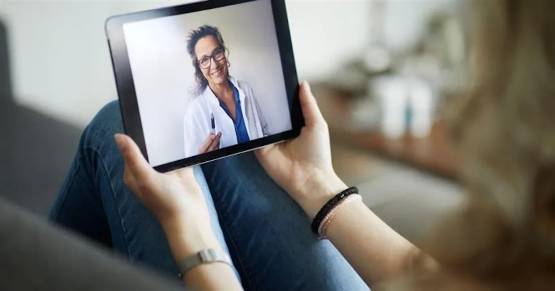 Person speaking to healthcare provider on a tablet